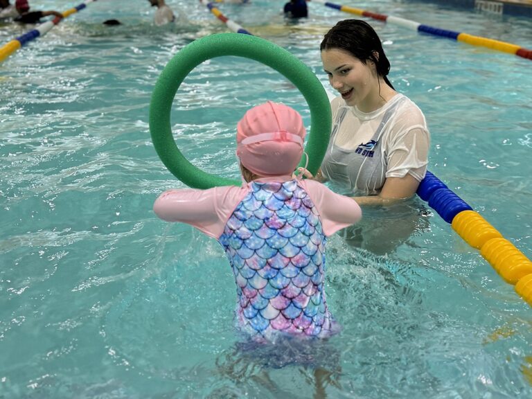 Swimmer practising with a pool noodle ring at WD Swim Richmond Hill